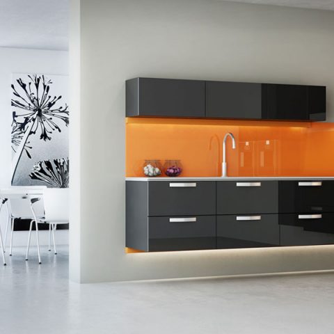 A black and orange themed bespoke fitted kitchen